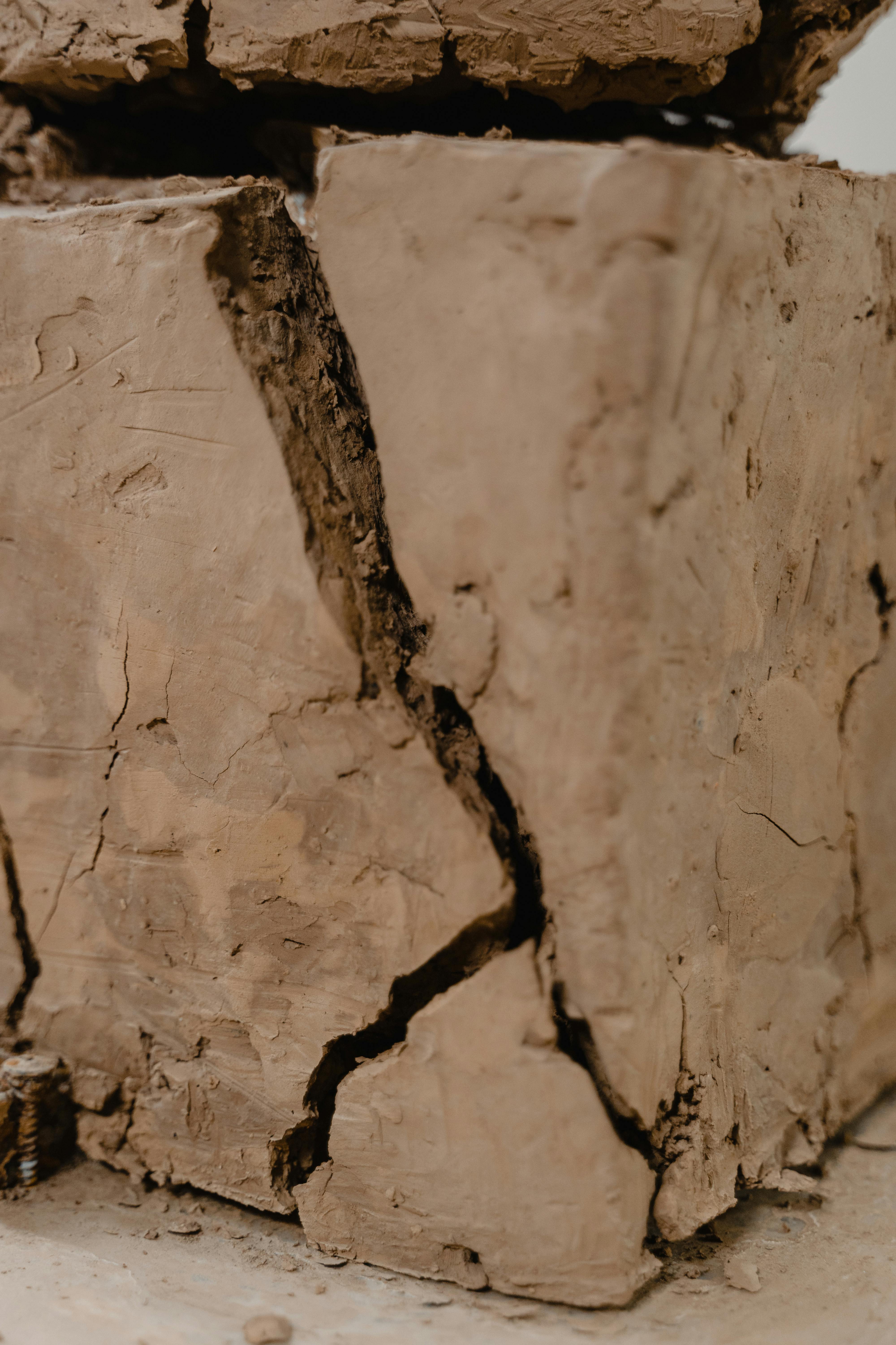 a block of clay with cracks