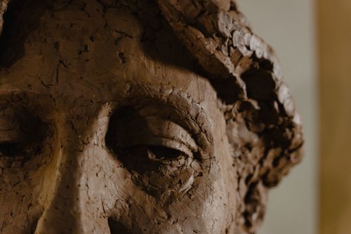 Free Intricate close-up of a handmade clay sculpture showcasing detailed textures and craftsmanship. Stock Photo