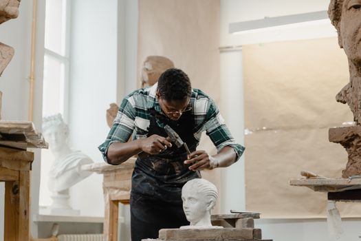 A Man Working on a Sculpture