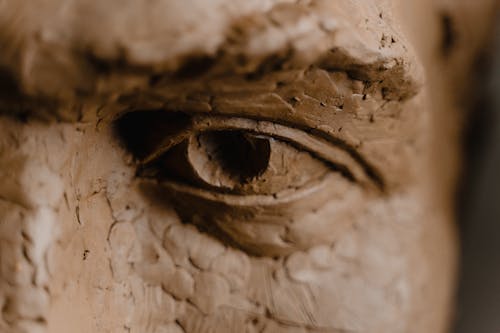 Close Up Photo Of Clay Head Sculpture With Focus On Eye