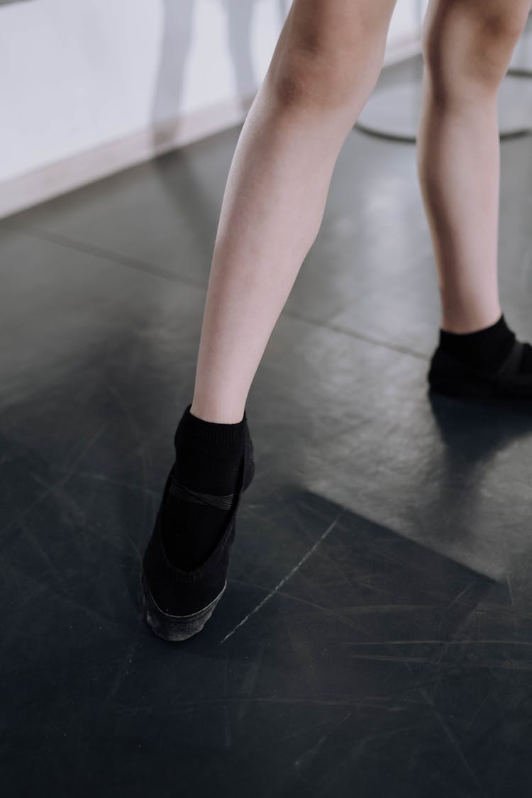 Person Wearing A Black Ballet Shoes