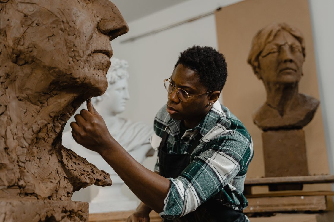 A Man Making a Clay Sculpture · Free Stock Photo