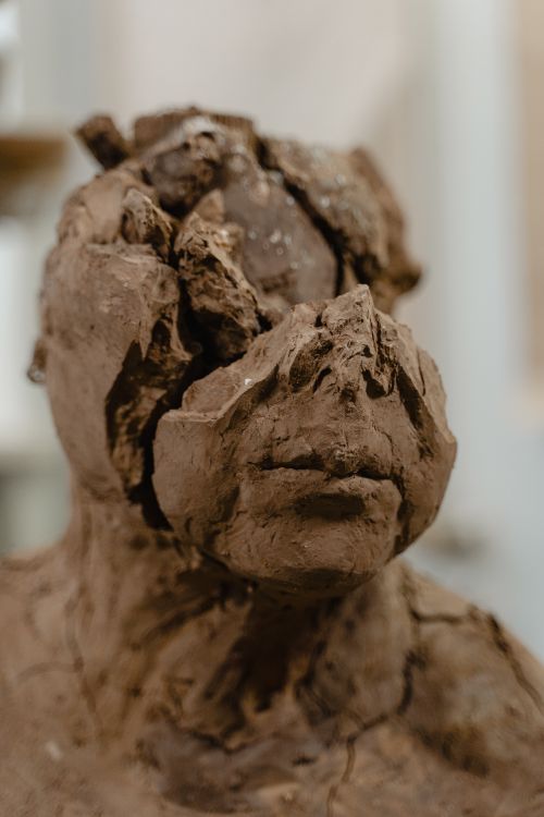 Free Close-up of an abstract clay sculpture focusing on texture and form. Stock Photo