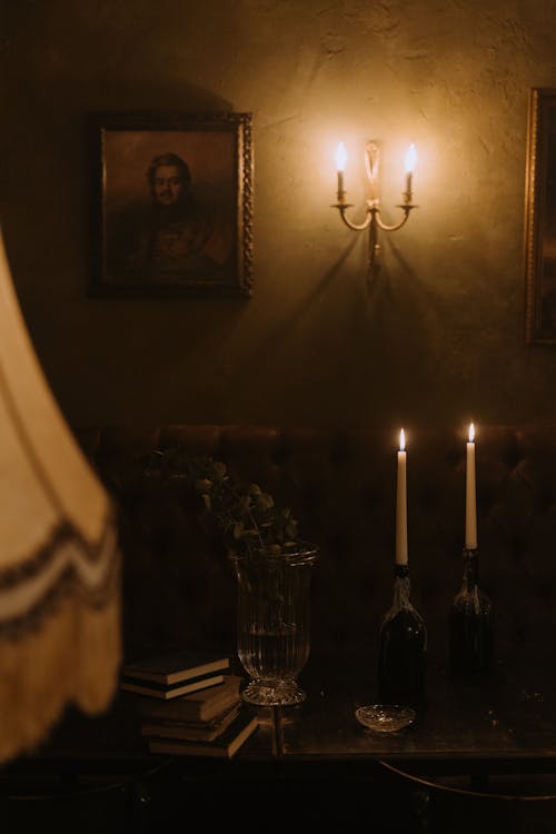 Candles on Table in Dark Room with Retro Interior Design