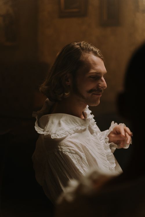 Free Elegant portrait of a man in vintage attire with soft lighting and historic ambiance. Stock Photo