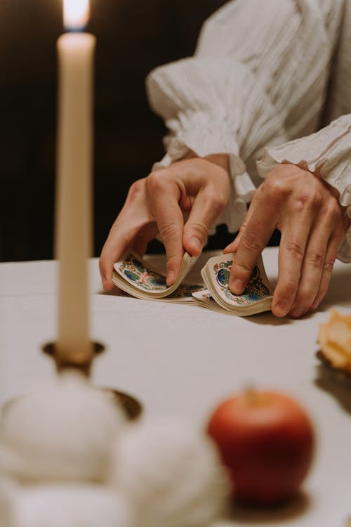 Free A Person Shuffling Cards Stock Photo