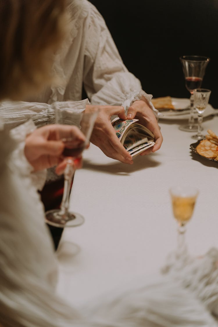 A Person Shuffling Cards