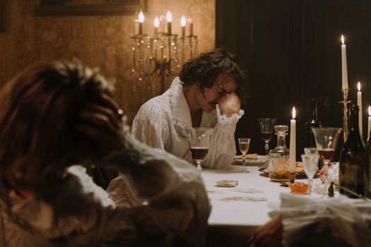 A Man Sitting at the Table