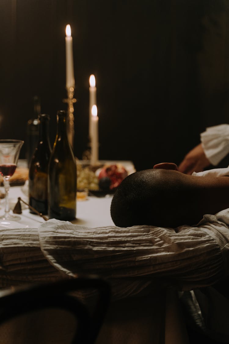 A Man Sleeping On The Table