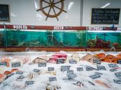 Vibrant fish market scene showcasing a variety of fresh seafood on ice in Moscow.