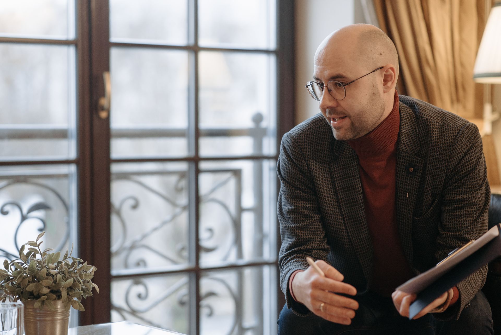A professional counseling session with a therapist in a modern office setting, emphasizing dialogue and support.
