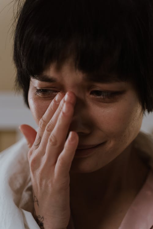 Free A Sad Woman Wiping Her Tears Stock Photo