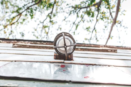Silver Round Ornament on Gray Wooden Plank