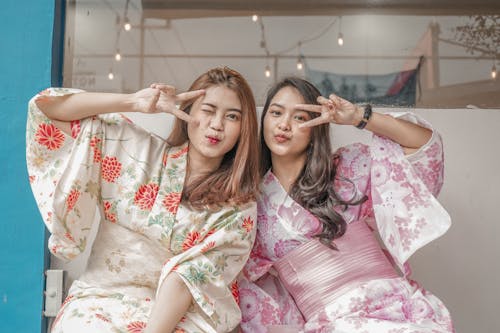 Two Young Japanese Women Wearing Kimonos 