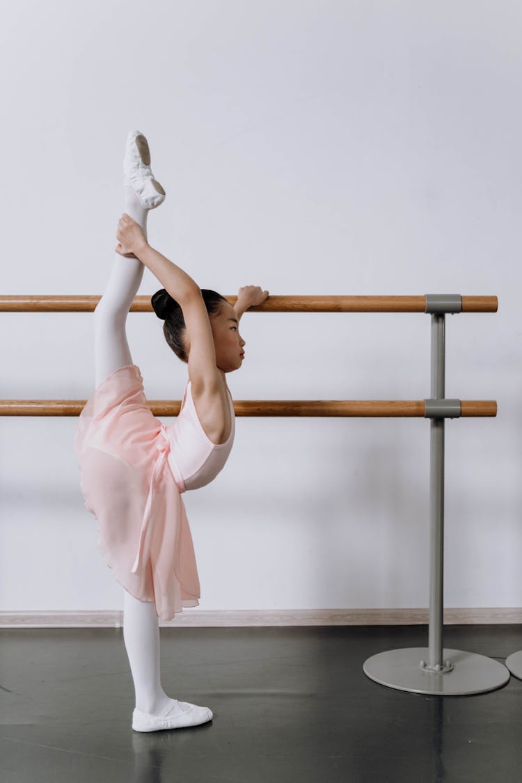 Ballerina Holding On Wooden Barre