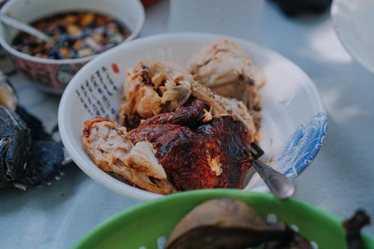 Delicious grilled chicken served in a decorative bowl, perfect for a food photography session.