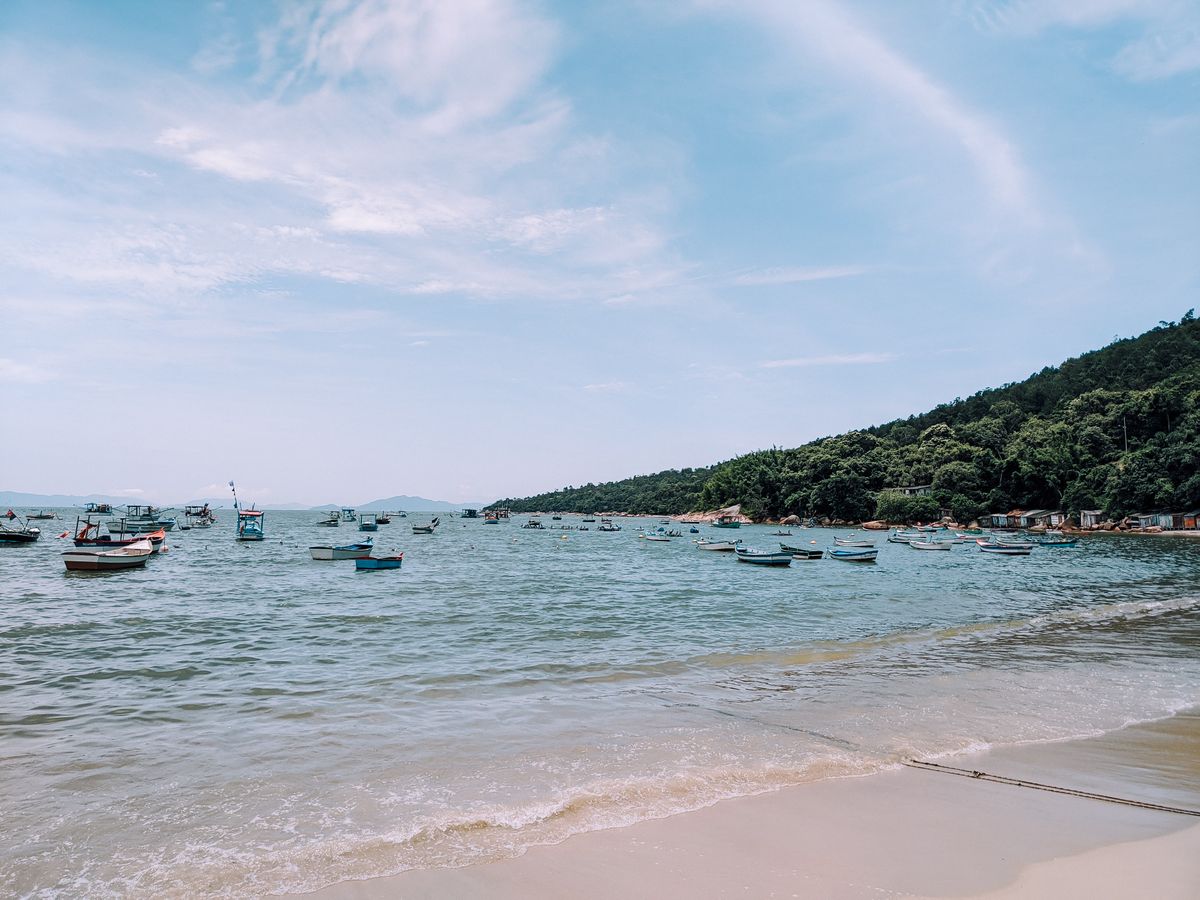 Boats on a calm sea under a clear blue sky