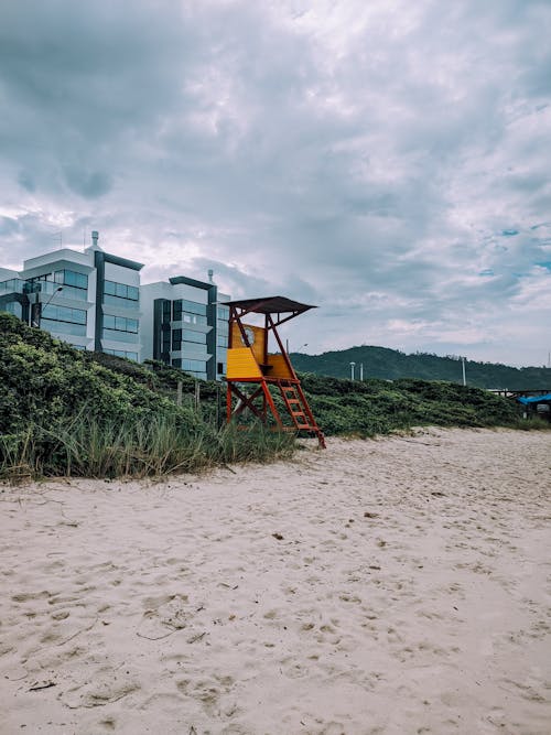 Free Photo of a Yellow Lifeguard Post on the Beach Stock Photo