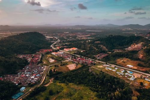 Free Stunning aerial view of Chukai town in Terengganu, Malaysia, showcasing landscapes, houses, and lush greenery. Stock Photo