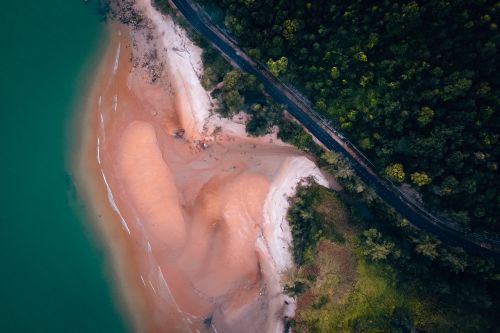 Free A stunning aerial view of the Chukai coastline in Malaysia, showcasing vibrant coastal terrain. Stock Photo