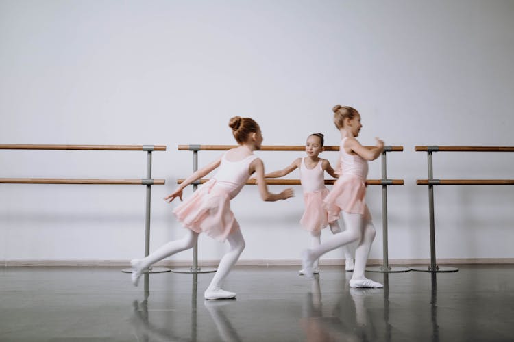 Photograph Of Ballerinas Playing