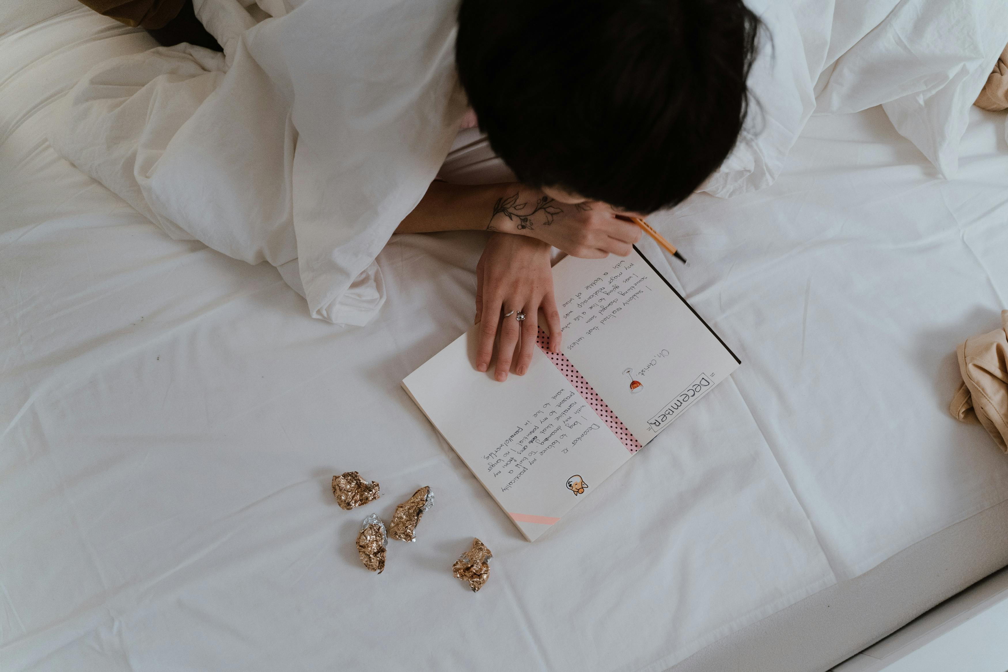 A person thoughtfully writing down brand values and personality traits - brand strategy definition