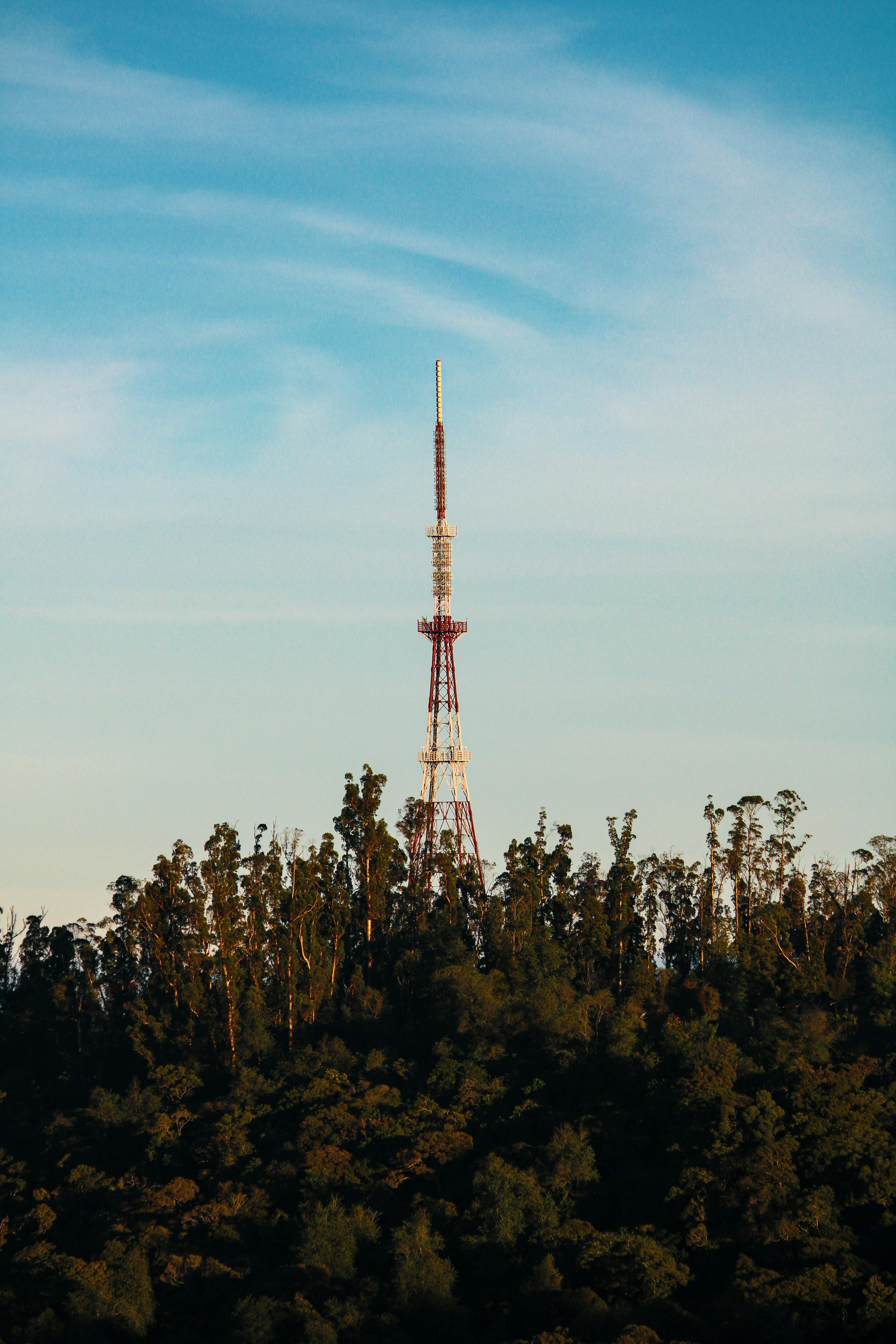 broadcasting tower against cloudy sky