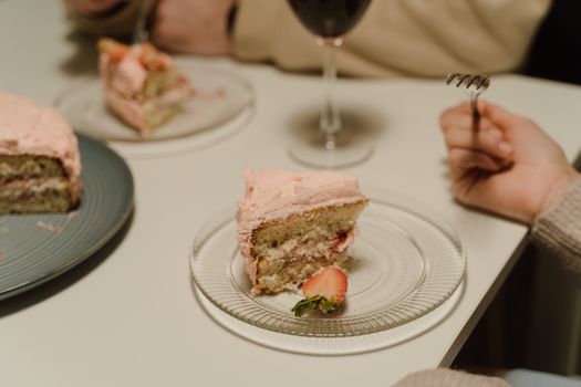 Delicious slice of strawberry cake on a plate, perfect for dessert lovers.
