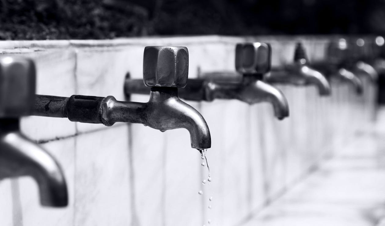 Water Drops from Stainless Steel Faucet