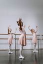3 Women in Pink Dresses