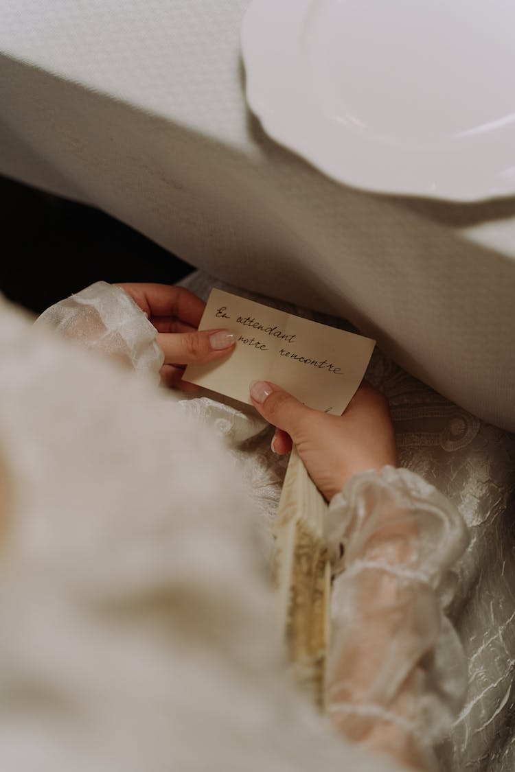 Close Up Shot Of A Person Holding A Note