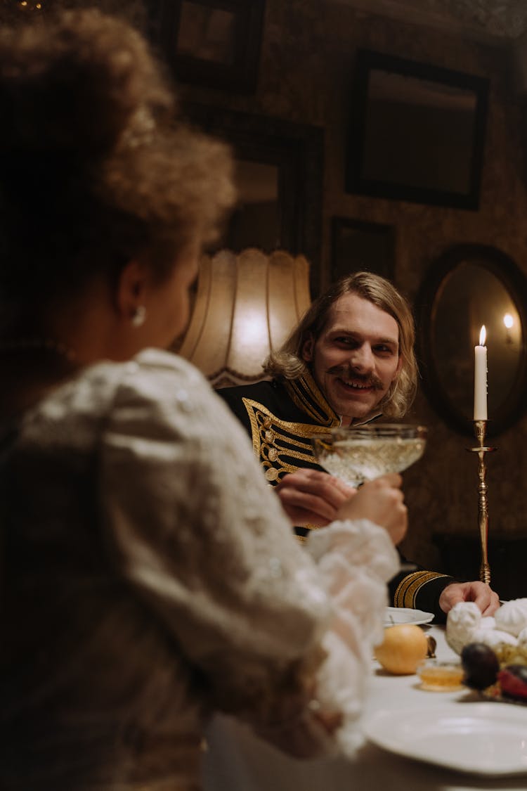 Man And Woman Toasting Their Champagne Glasses