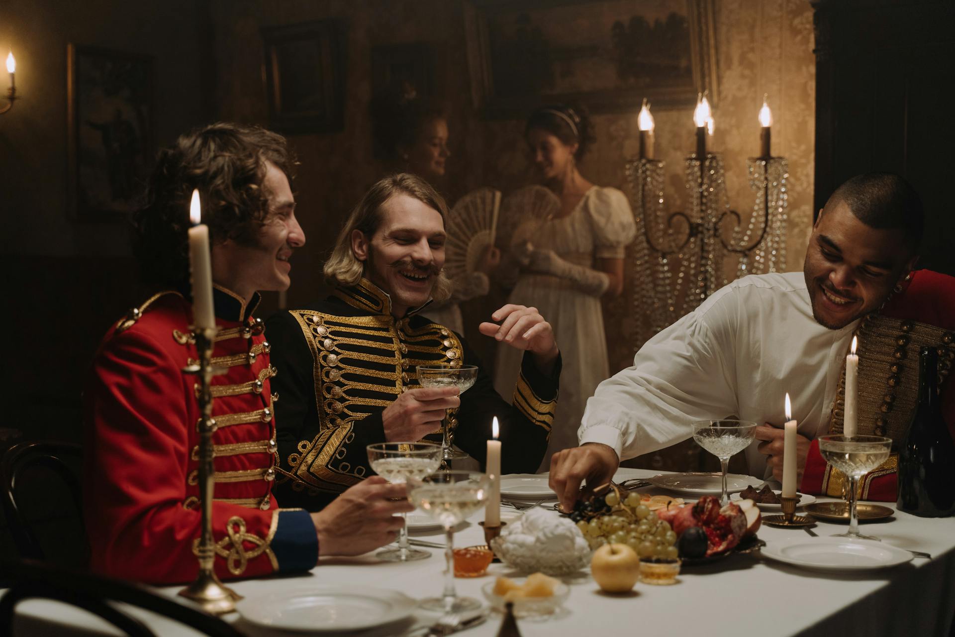 Men in British Military Costumes Sitting by the Table Having a Feast