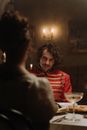 A Man Sitting at the Table