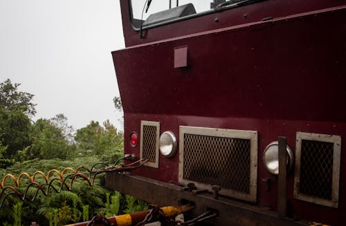 Red and Black Train on the Rail Tracks