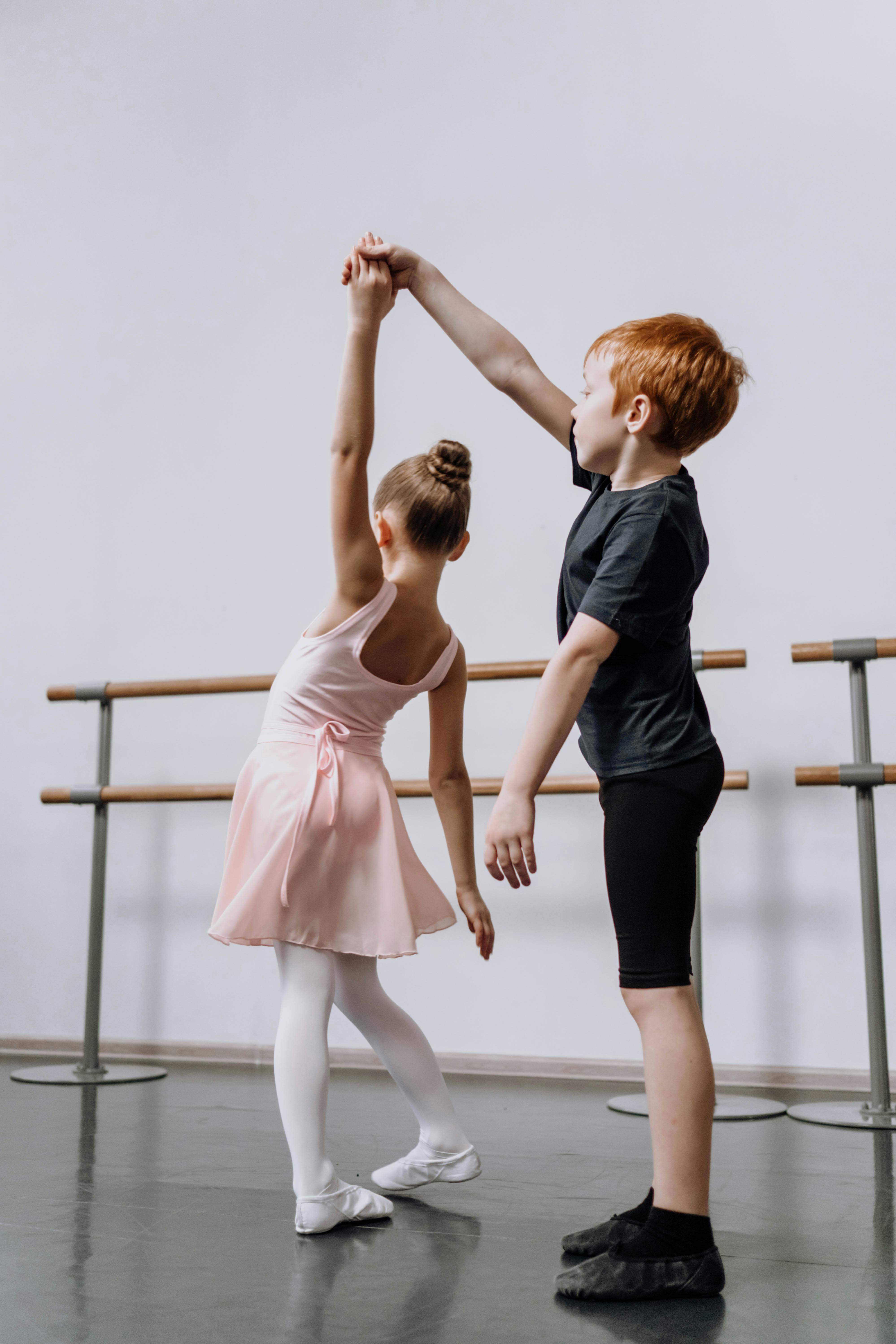 Boy and girl ballet dancers performing port de bras side stretches, Stock  Photo, Picture And Rights Managed Image. Pic. DOD-00555264