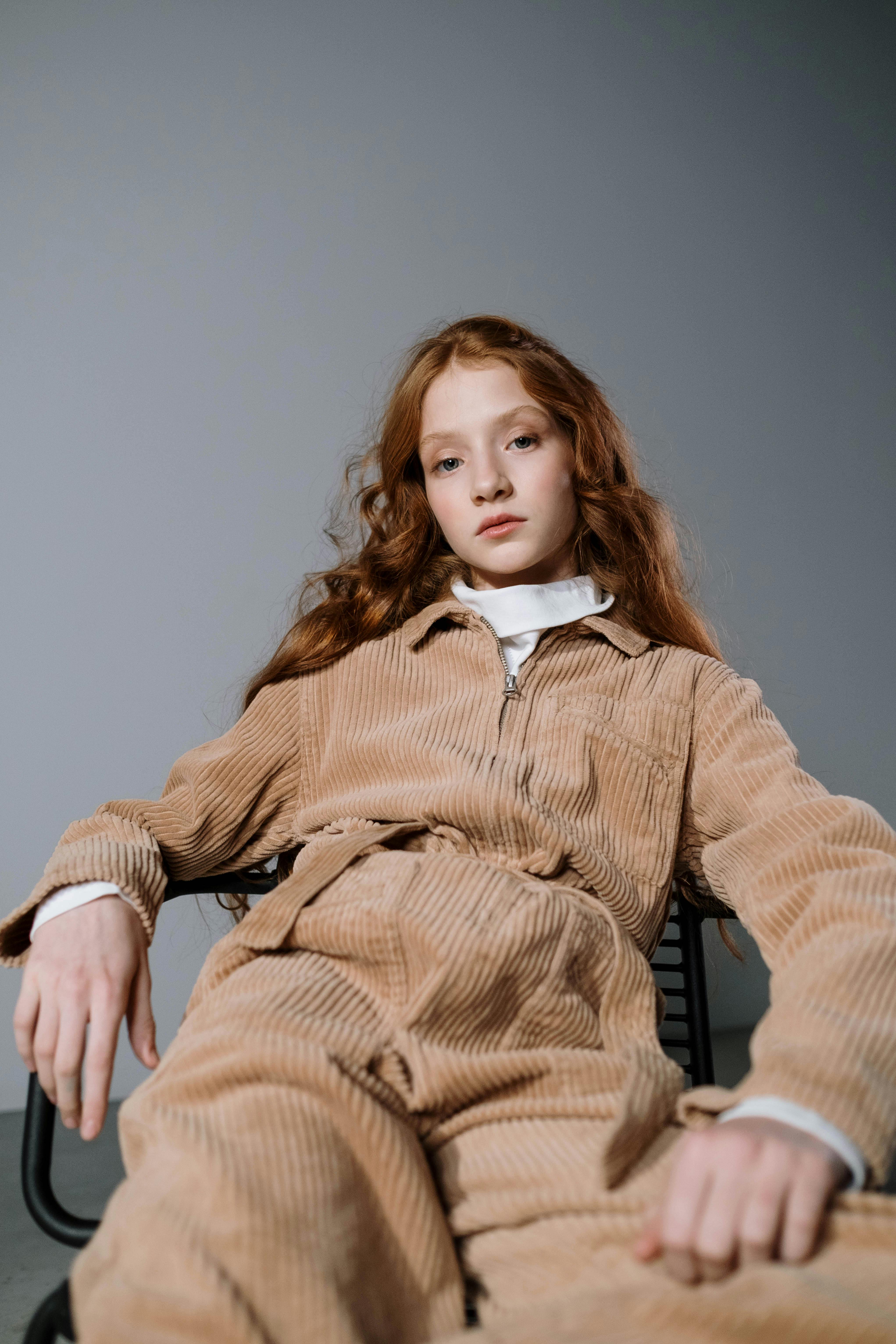 a woman in brown long sleeve shirt