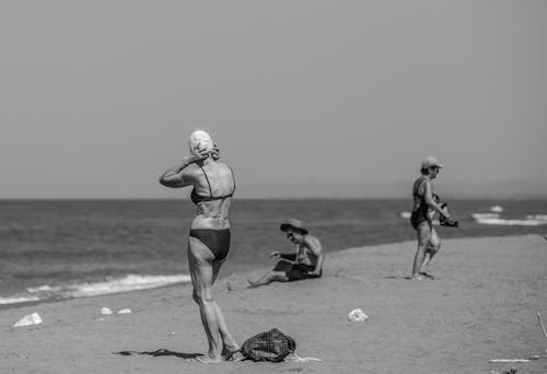 A Grayscale Photo of People on the Beach