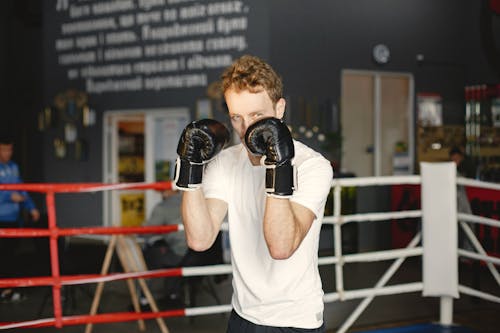 Free A Man Wearing Black Boxing Gloves Stock Photo