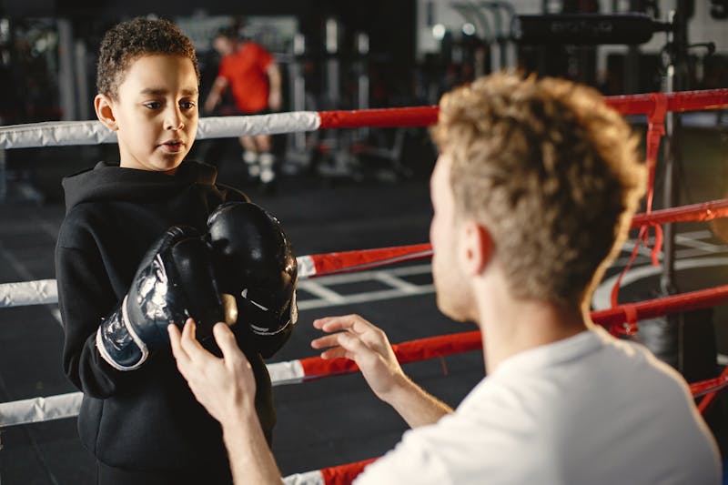 Black and white photo of Cyrillic letters forming 'верь' on a wooden surface.