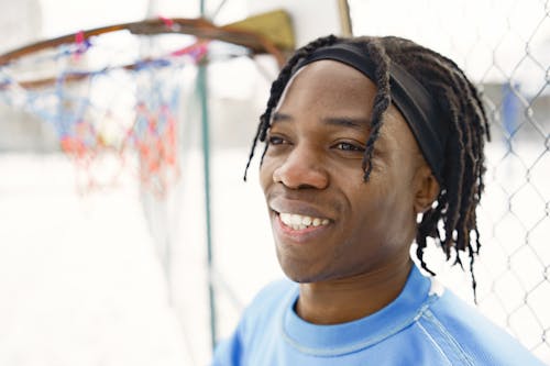 Smiling Man with Dreadlocks 