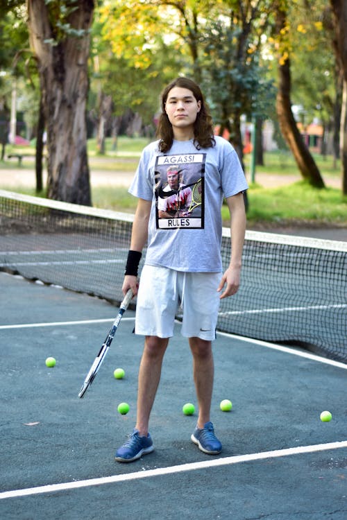 Man Holding a Tennis Racket