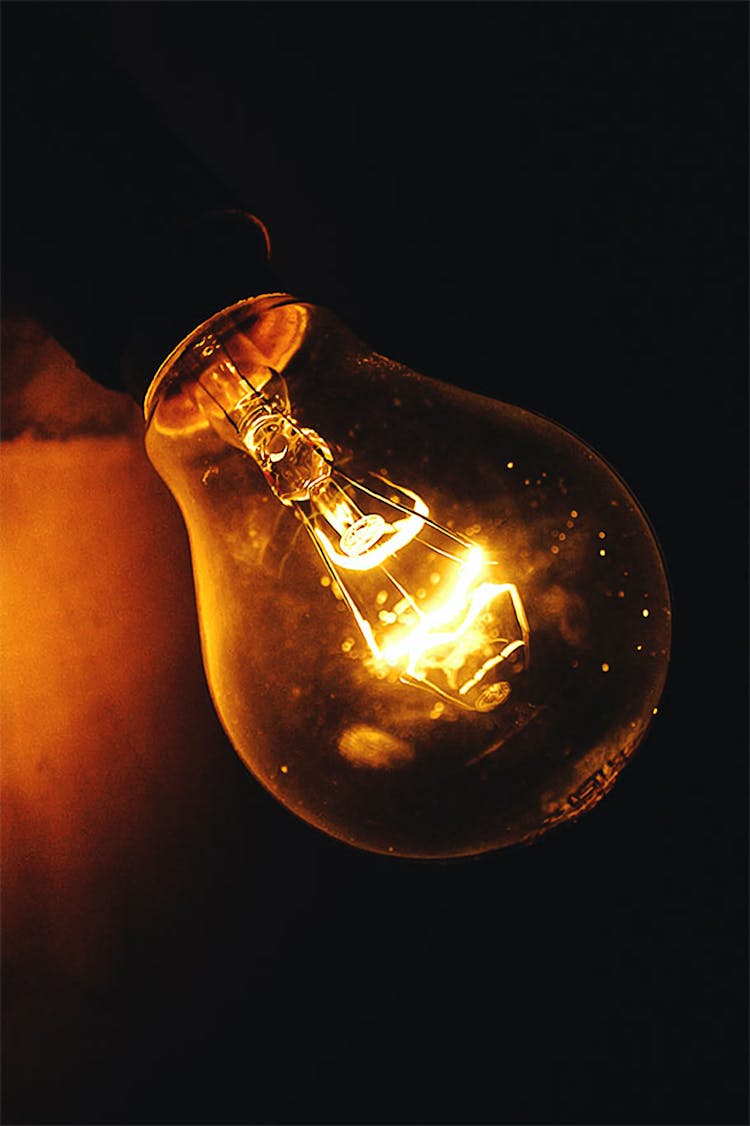 Close-up Photography Of Lighted Light Bulb