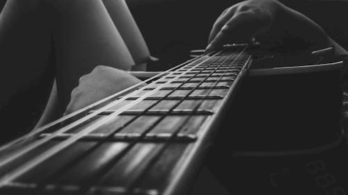 Free Person Holding an Acoustic Guitar Stock Photo