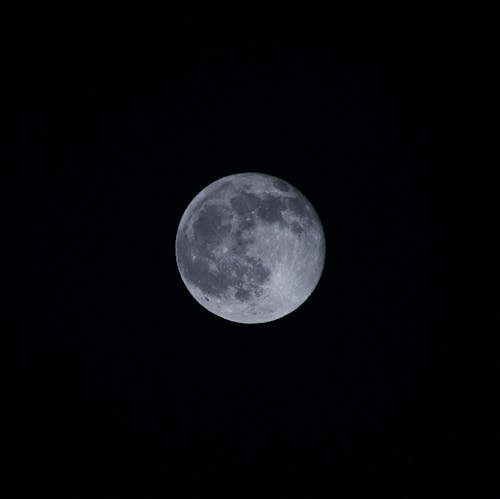 Free Close-Up Shot of a Full Moon in the Night Sky Stock Photo