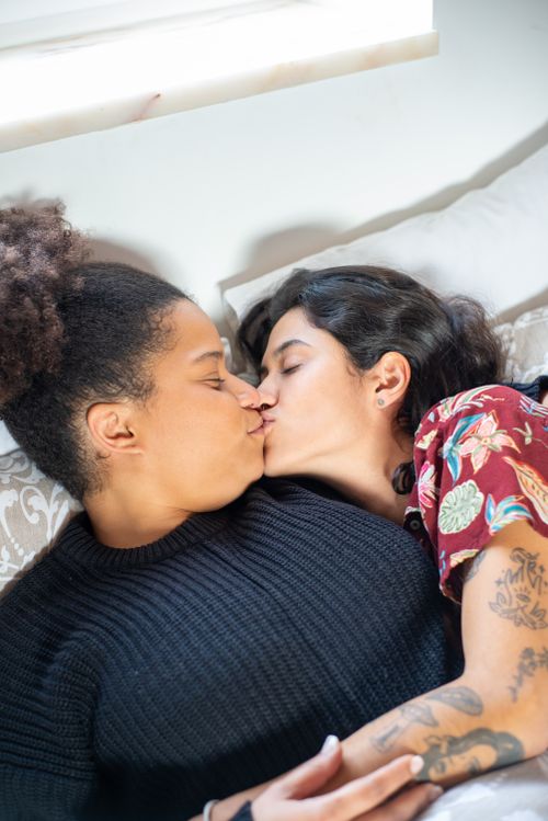 Free Close-up of a loving multicultural couple sharing an intimate moment together indoors. Stock Photo