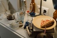 Clear Drinking Glass Beside White Ceramic Plate on Table