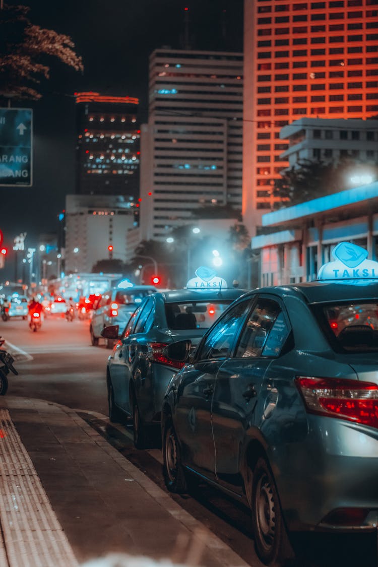 A Cars Parked On The Street At Night