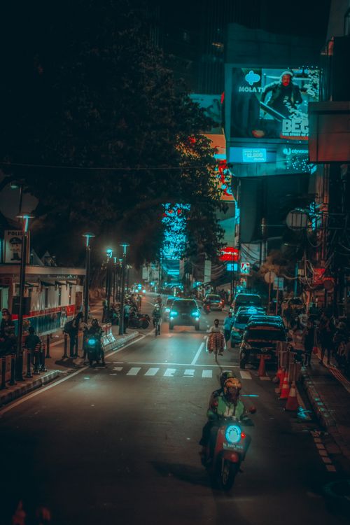 Free Nighttime urban scene in Jakarta showcasing lively streets and vibrant city lights. Stock Photo