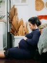 A Pregnant Woman in a Blue Long Sleeves Dress